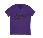 Purple t-shirt with 'Abundance' text on a white background