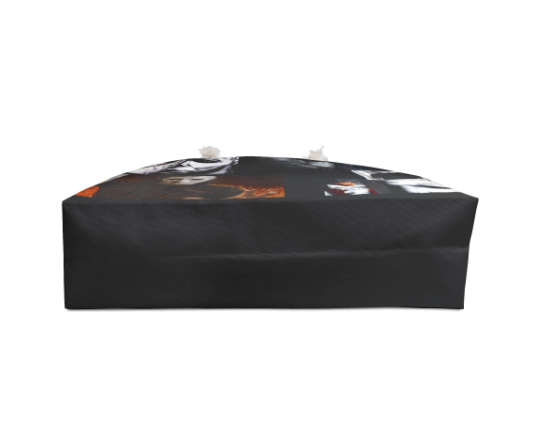 Black rectangular object with a pattern on a white background