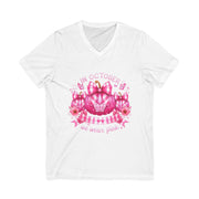 White t-shirt with pink pumpkin and ribbon design on a white background