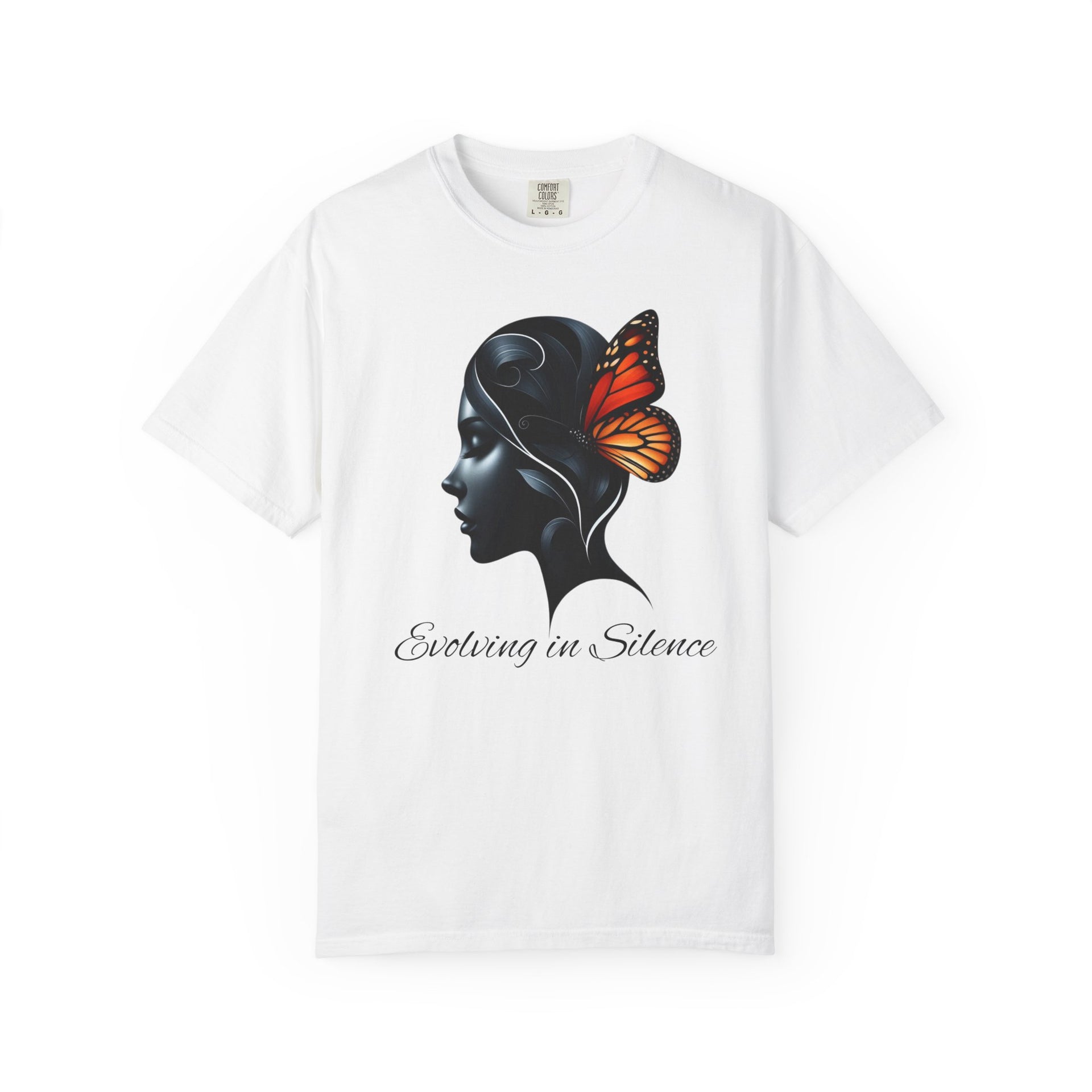 White t-shirt with a black silhouette of a woman with a butterfly on her head and text 'Evolving in Silence' on a white background.