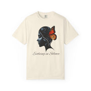 Beige t-shirt with a black silhouette of a woman's head and a butterfly, with text 'Evolving in Silence', on a white background.