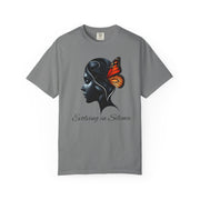 Gray t-shirt with a black silhouette of a woman's head and a butterfly, with text 'Evolving in Silence', on a white background.