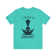 Turquoise t-shirt with a black silhouette of a person meditating and text 'I MATCH ENERGY' on a white background.