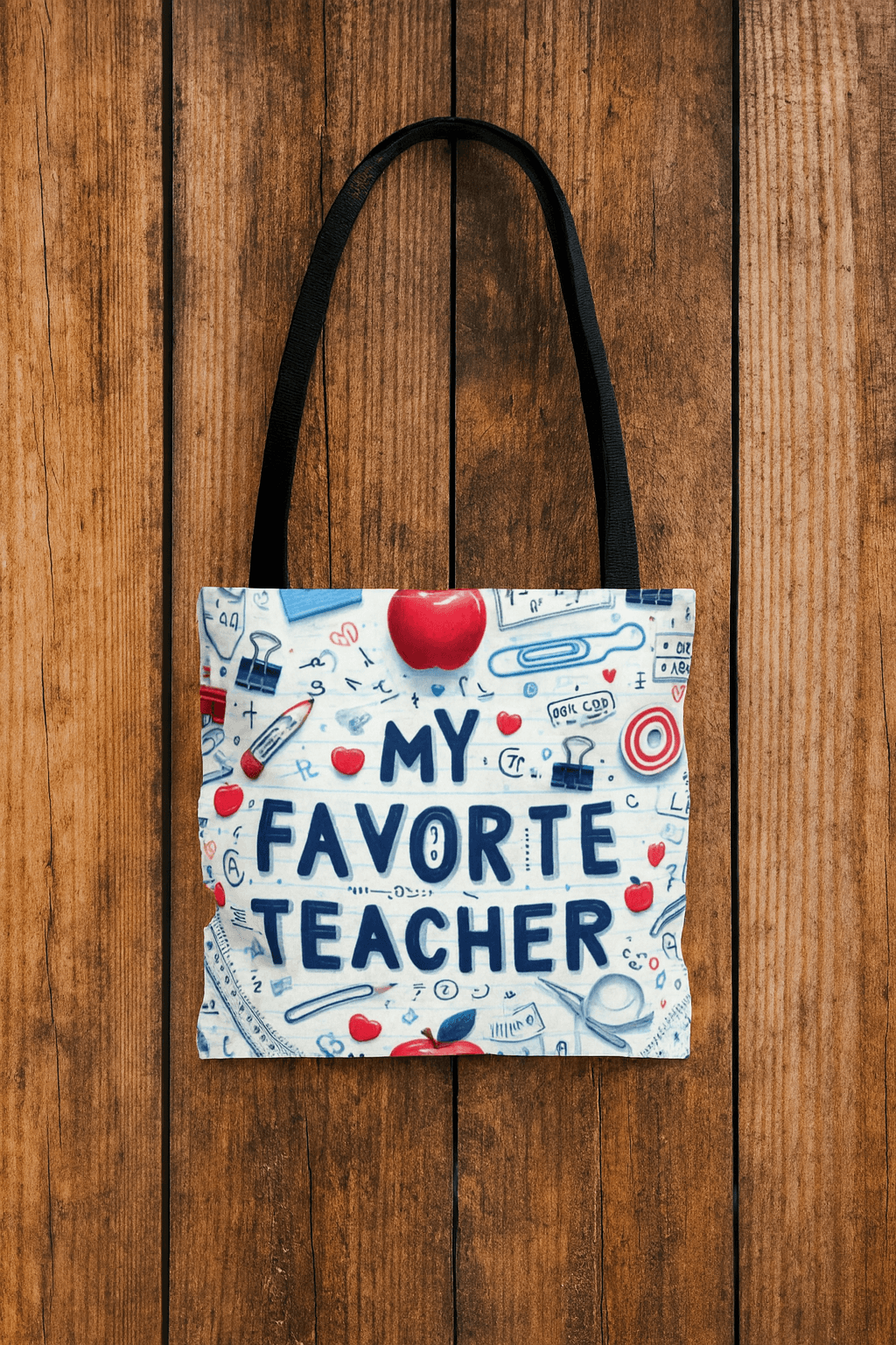 Tote bag with 'My Favorite Teacher' text on a wooden surface