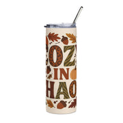 Tumbler with autumn-themed design and straw on a white background