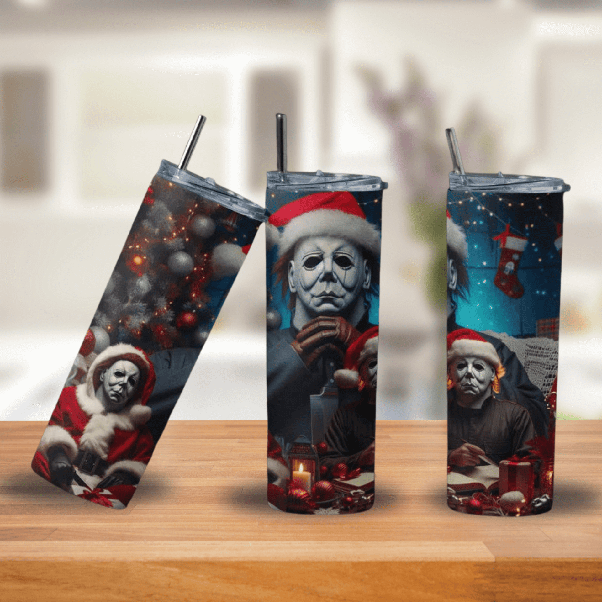 Three tumblers with festive design featuring a character in a Santa hat on a wooden surface.