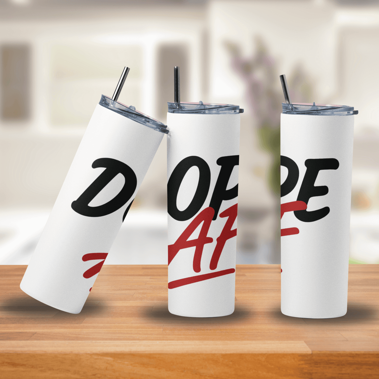 Three white tumblers with 'Dope AF' text on a wooden surface.