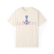 Beige t-shirt with 'Serenity' text and silhouette design on a white background
