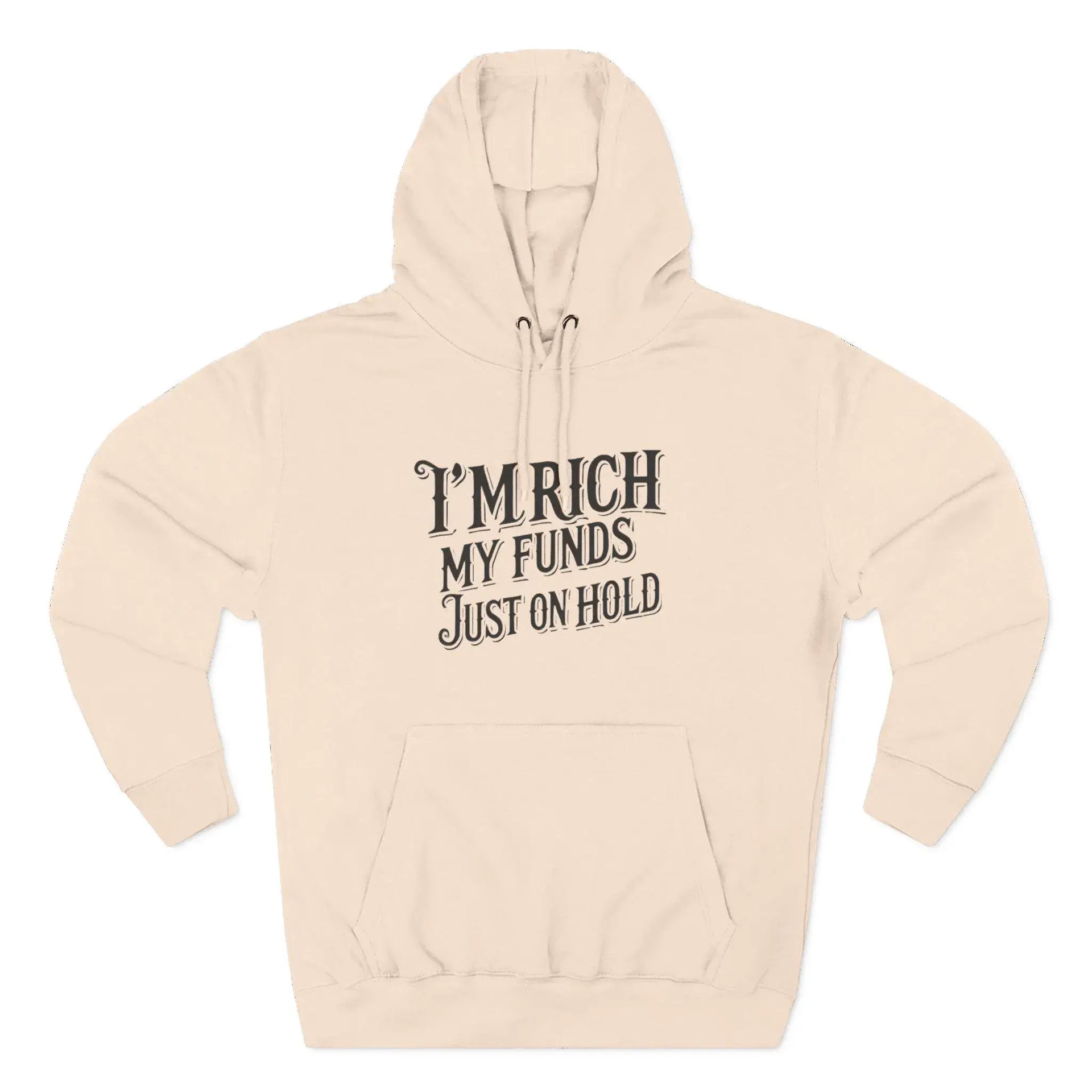 Beige hoodie with text 'I'm rich, my funds just on hold' on a white background