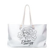 White tote bag with 'Divine energy' design on a white background