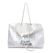 White tote bag with 'Divine energy' text and design on a white background