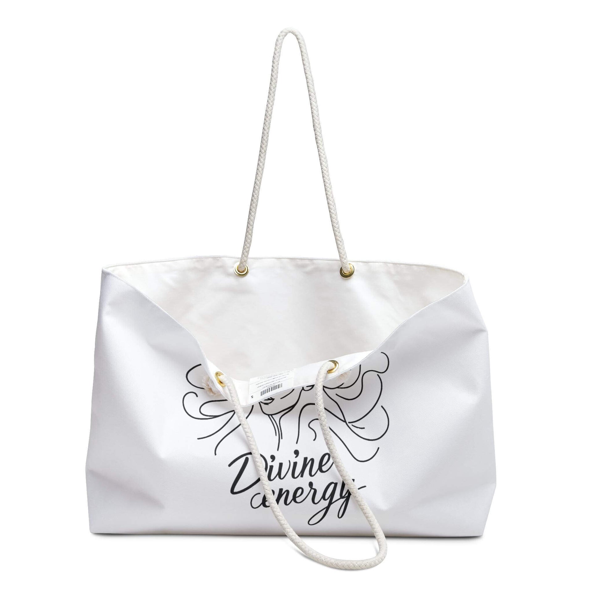 White tote bag with 'Divine energy' text and design on a white background