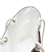 White drawstring bag with floral pattern on a white background