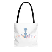 White tote bag with 'Serenity' text and a silhouette of a person in a meditative pose on a white background.