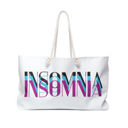 White tote bag with 'INSOMNIA' text in colorful letters on a white background