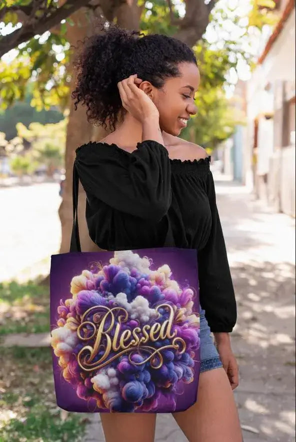 Woman holding a tote bag with 'Blessed' design outdoors