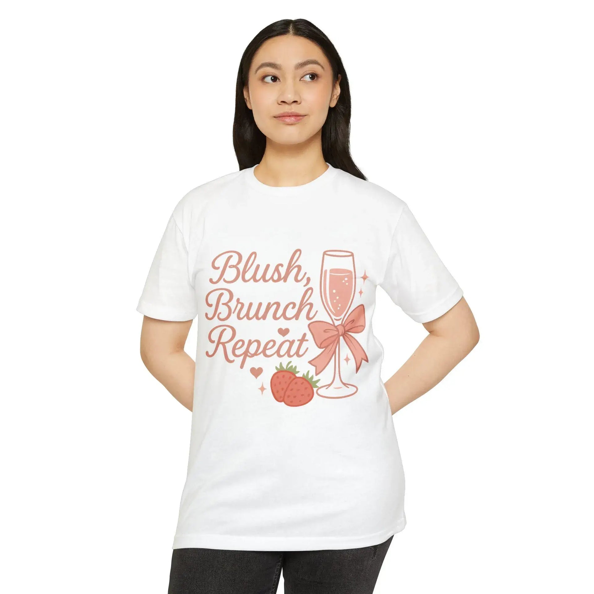 Woman wearing a white t-shirt with 'Blush, Brunch, Repeat' text and graphics on a white background