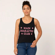 Person wearing a black tank top with 'MAIN CHARACTER CLUB' text and stars on a plain background