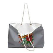 Gray tote bag with a colorful design featuring a rose and text on a white background