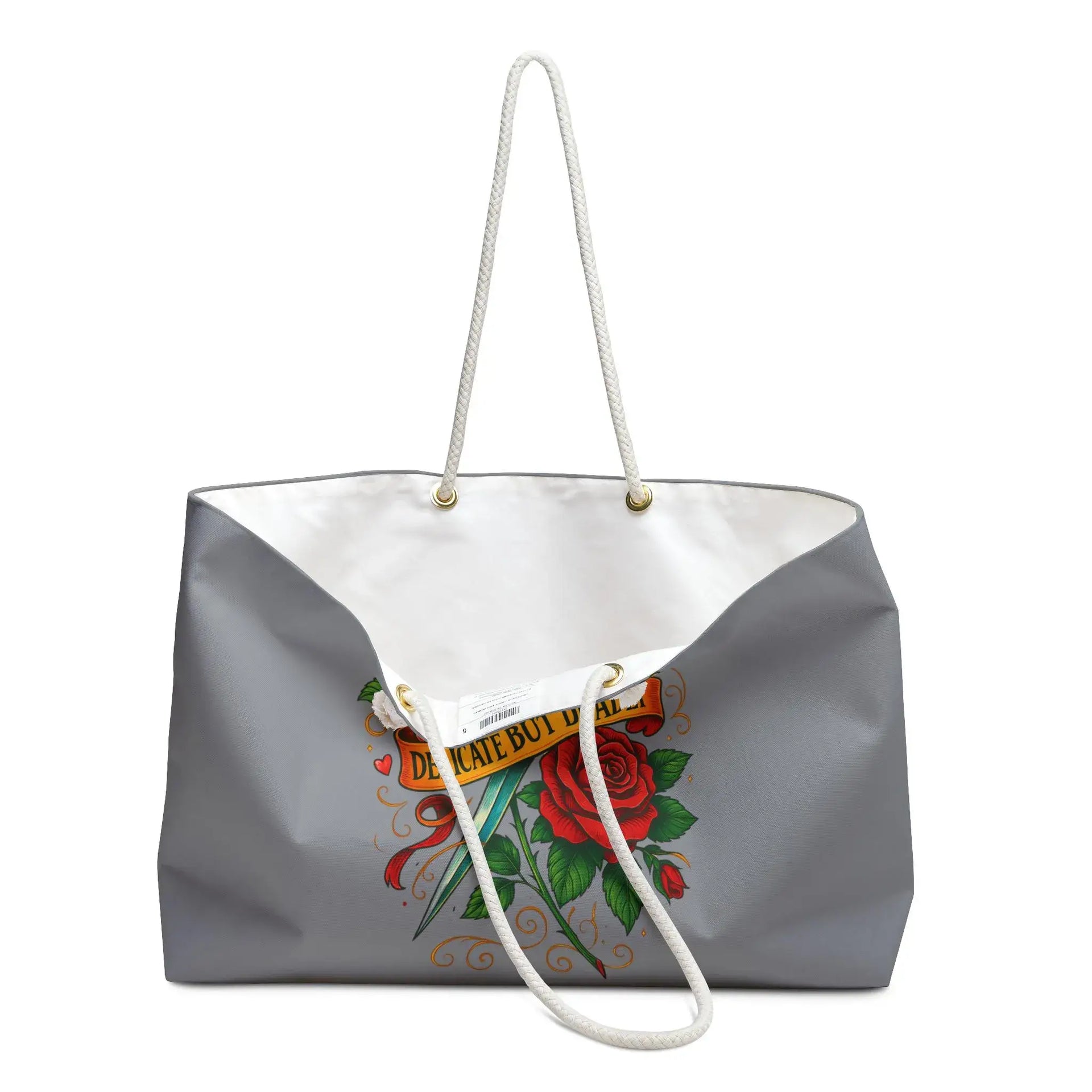 Gray tote bag with a colorful design featuring a rose and text on a white background