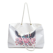 White tote bag with pink and blue design and text on a white background