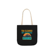 Black tote bag with colorful text and graphics on a white background