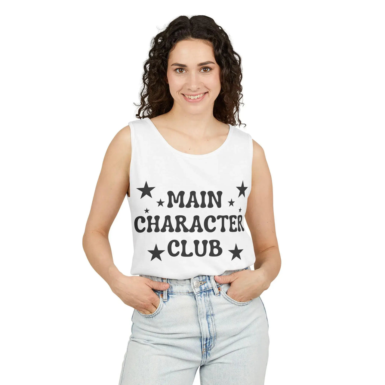Woman wearing a white tank top with 'MAIN CHARACTER CLUB' text and stars, standing against a white background.