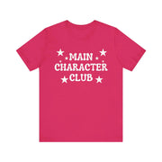 Pink t-shirt with 'Main Character Club' text and stars on a white background
