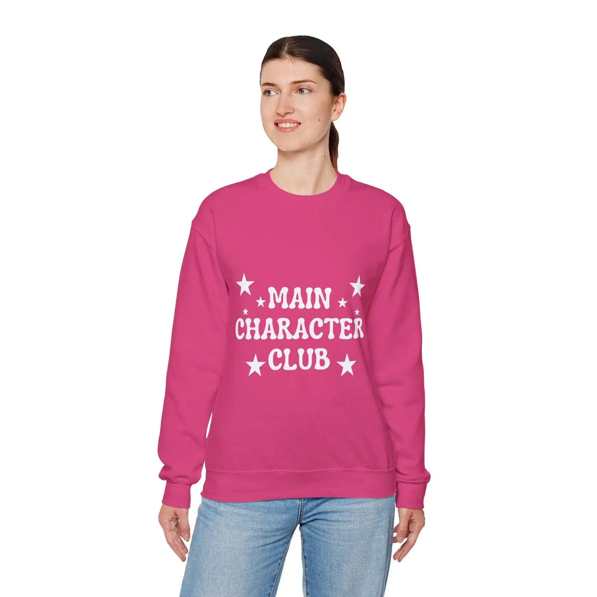 Person wearing a pink sweatshirt with 'Main Character Club' text on a white background