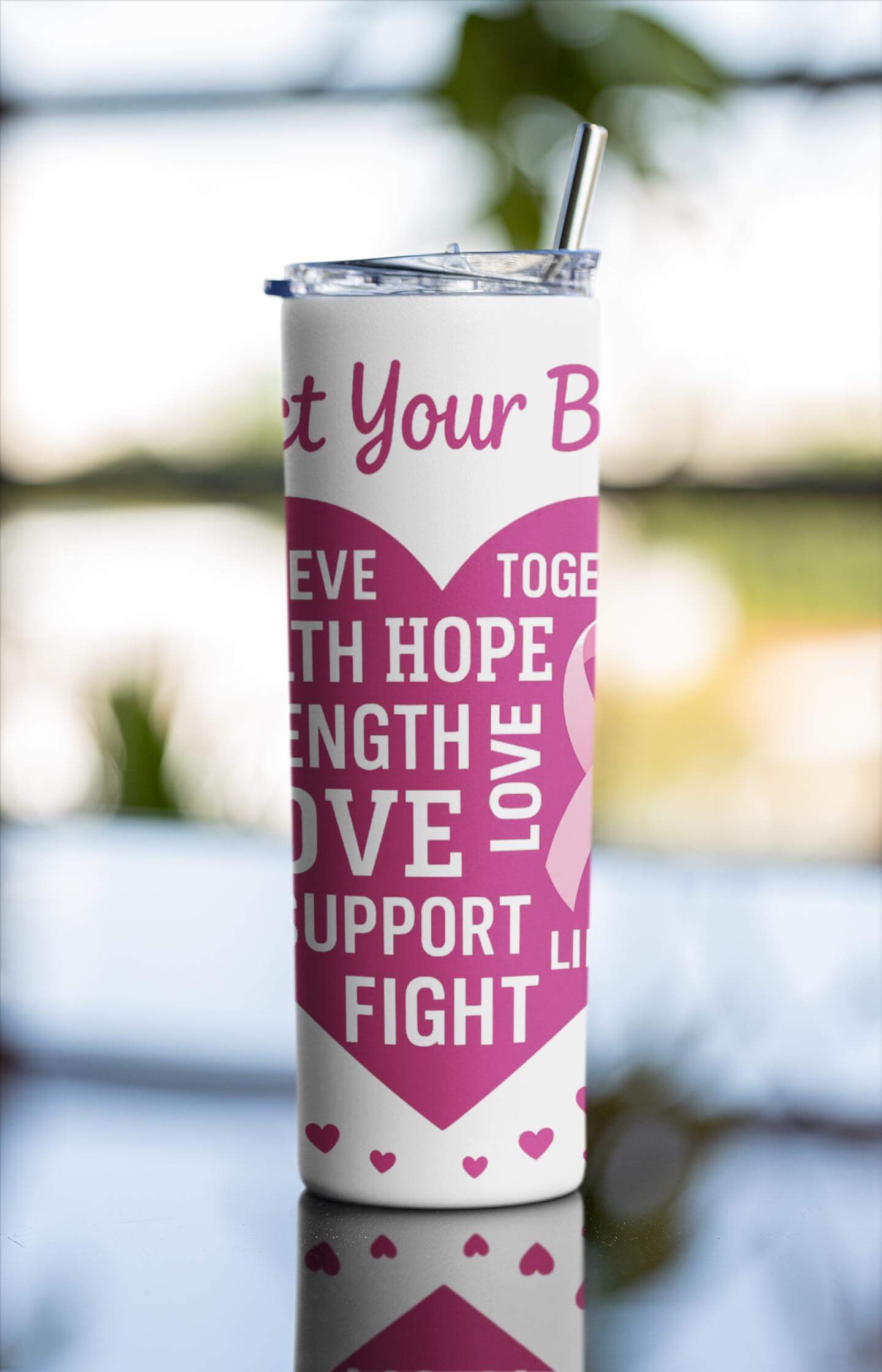 Tumbler with motivational quote and heart design outdoors