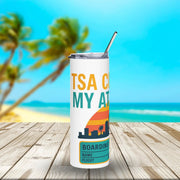 Tumbler with 'TSA CLEAR MY AT' text on a beach background
