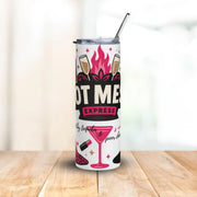 Tumbler with cocktail-themed design on a wooden surface