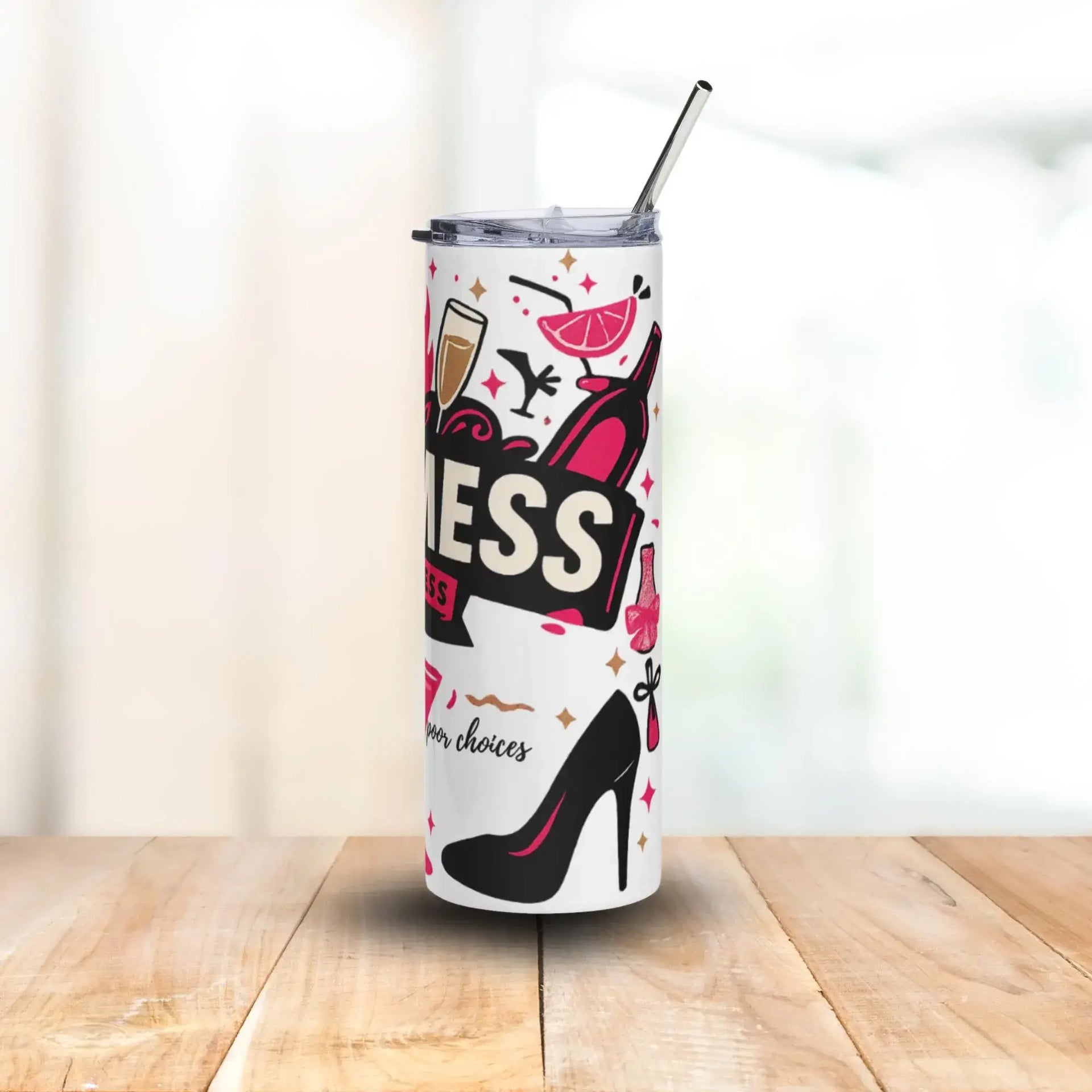 Tumbler with high-heeled shoe design and text on a wooden surface