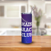 Purple tumbler with 'MAIN CHARACT CLUB' text on a wooden surface with a blurred background
