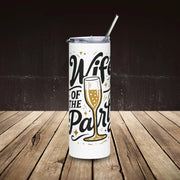 Tumbler with 'Wife of the Party' text and champagne glass design on a wooden surface.