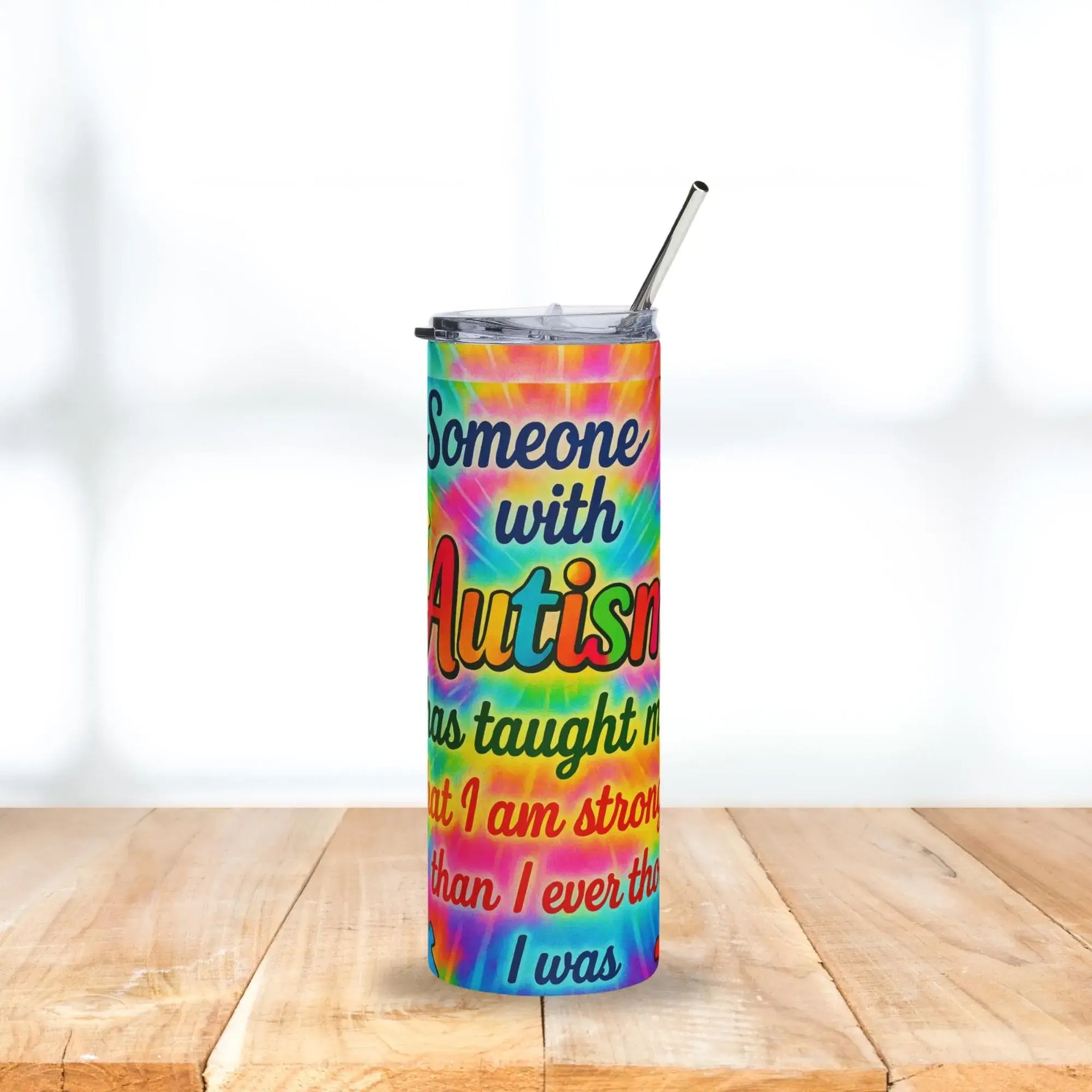 Tumbler with motivational quote on a colorful background