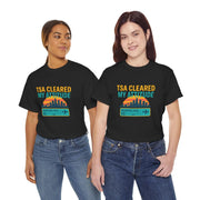 Two people wearing black t-shirts with 'TSA Cleared My Attitude' design on a white background