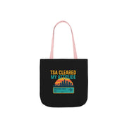 Black tote bag with colorful text and graphics on a white background
