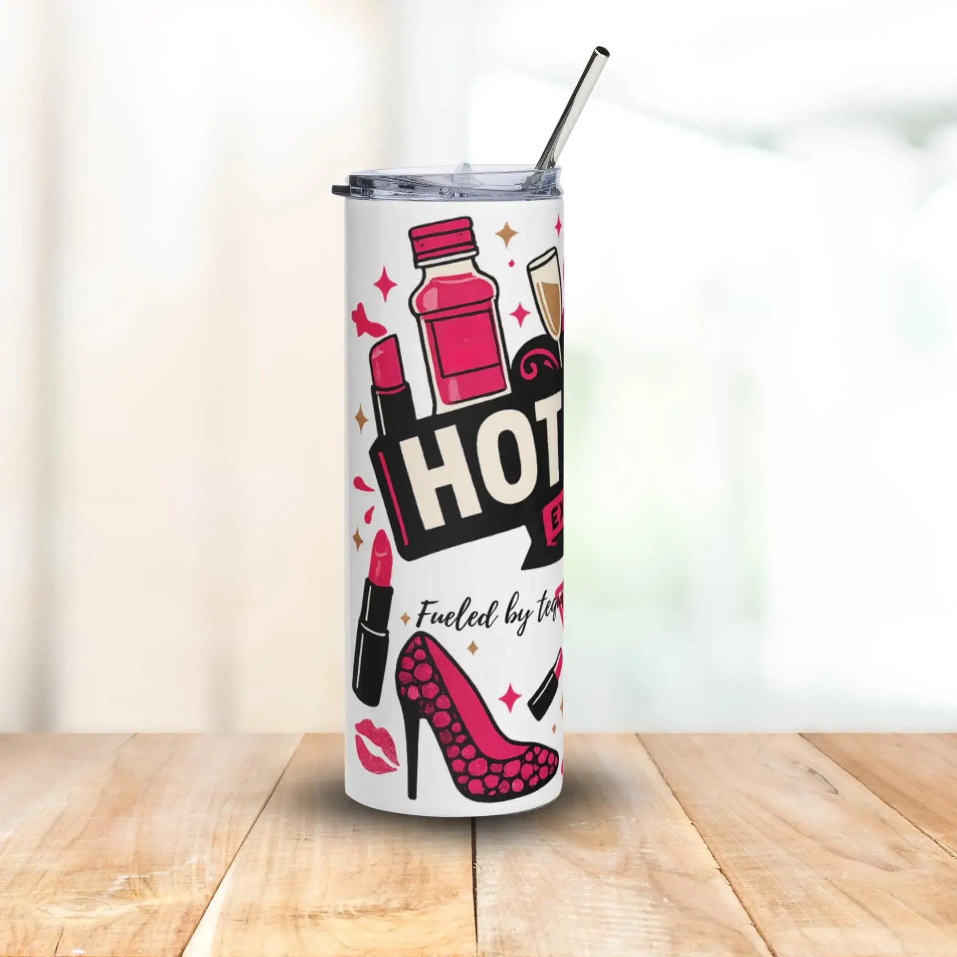 Tumbler with 'Fueled by Hot' design featuring a bottle, lipstick, and high heels on a white background.
