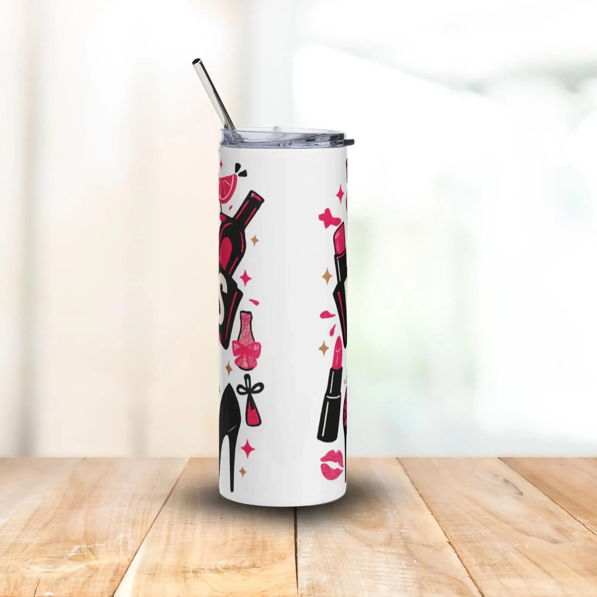 Tumbler with nail polish and high heel design on a wooden surface with a white background