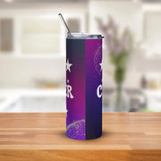 Purple tumbler with a star design on a wooden surface