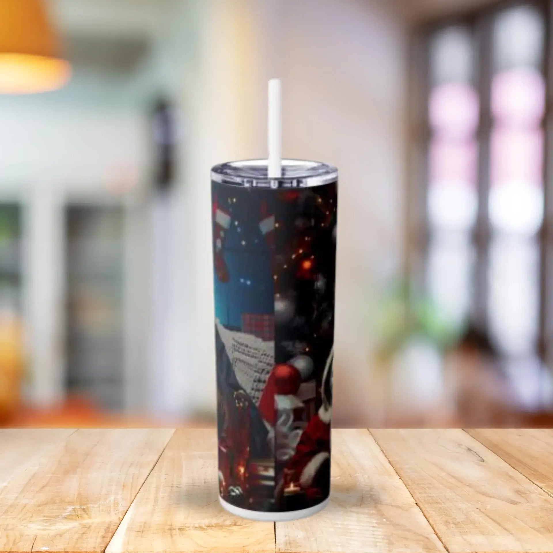 Tumbler with a design on a wooden table with a blurred background