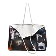 Tote bag with graphic design of faces on a white background