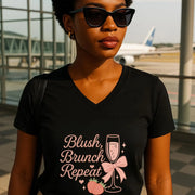 Woman wearing a black t-shirt with 'Blush, Brunch Repeat' design at an airport.