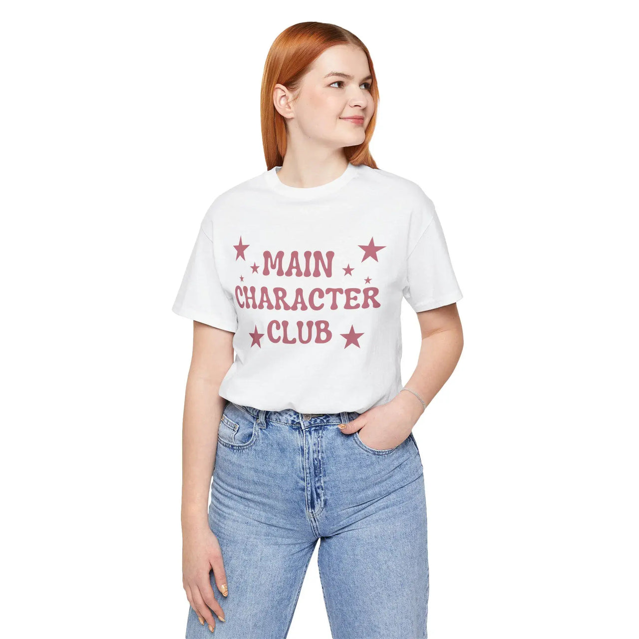 Person wearing a white t-shirt with 'MAIN CHARACTER CLUB' text and stars, standing against a white background.