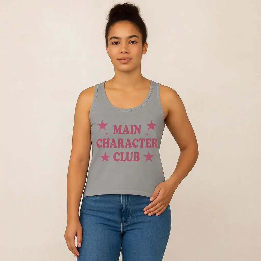 Person wearing a gray tank top with 'MAIN CHARACTER CLUB' text and stars on a beige background