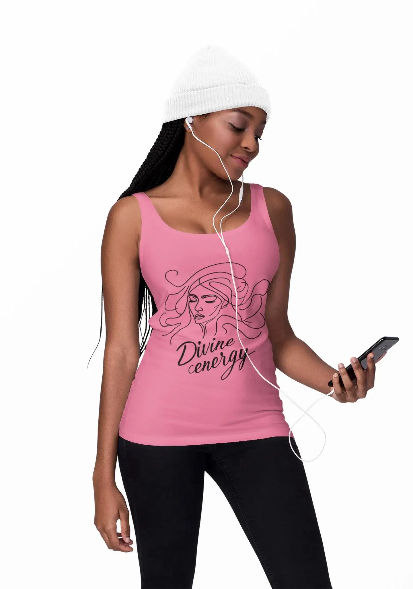 Woman wearing a pink tank top with 'Divine energy' text and listening to music on headphones.