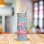 Tumbler with 'Too Sweet To Handle' design on a wooden table with a blurred background