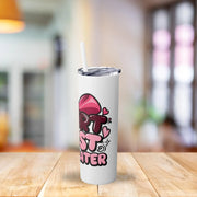 White tumbler with a colorful design on a wooden table with a blurred background