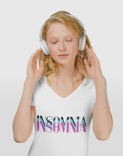 Woman wearing headphones and a white t-shirt with 'Insomnia' text on a light gray background